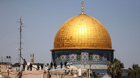 Israeli soldiers standing at the rooftop of the Al-Aqsa mosque