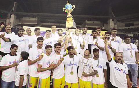 Tamil Nadu men?s team players, support staff and administrators pose with the trophy