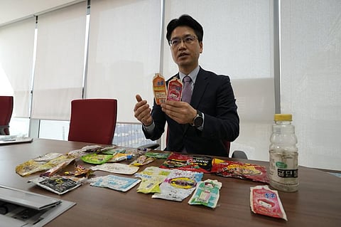 Kang Dong Wan, 48, a professor at South Korea's Dong-A University, speaks with trash from North Korea