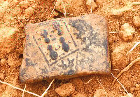 Unearthed punch marked coin with sea turtle symbol in Adichanallur