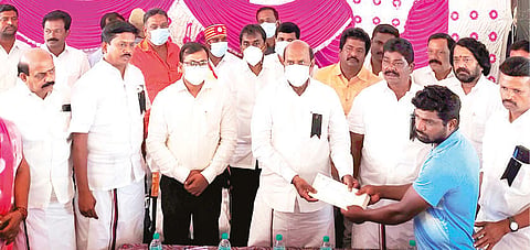 PWD Minister EV Velu giving a relief of Rs 2 lakh to accident victims in Tirupattur on Monday