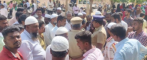 Parents of children protest in front of the school