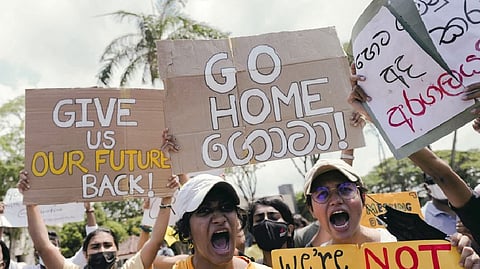 People shout slogans against Sri Lanka's President Gotabaya Rajapaksa and demand that Rajapaksa family politicians step down, during a protest