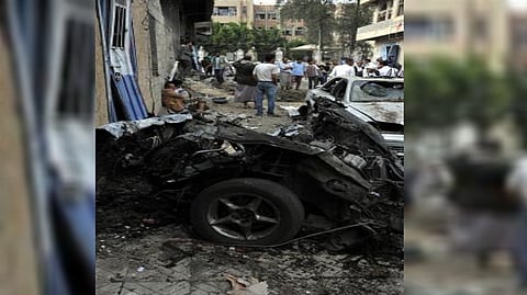 Wreckage of a vehicle at the scene of a blast in Aden