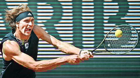 Alexander Zverev returns the ball to Sebastian Baez