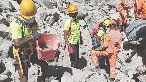 NDRF personnel clearing rocks to reach the body of last victim, on Sunday