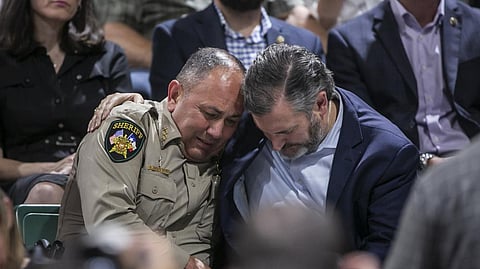 Uvalde County Sheriff Ruben Nolasco, left, is comforted by U.S. Sen. Ted Cruz during a vigil held in honor of the lives lost at Robb Elementary school at the Uvalde County Fairplex Arena in Uvalde