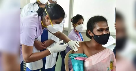 A transgender getting vaccinated for Hepatitis.