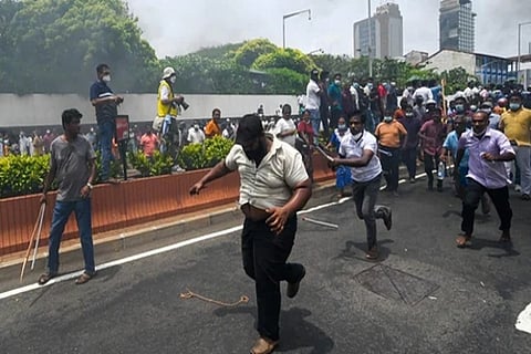 Demonstrators and government supporters clash