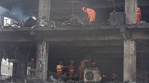 NDRF personnel during rescue and relief work after a massive fire at an office building near the Mundka Metro Station