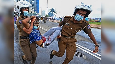 Police imposed an indefinite curfew in Sri Lanka's capital after government supporters clashed with demonstrators