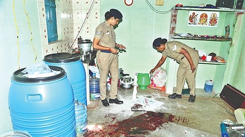 Police examine the crime scene at Tirupur on Monday