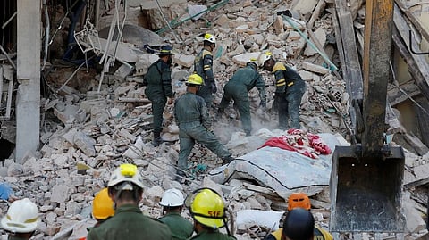 Rescue personnel working at the Hotel Saratoga
