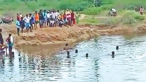 Rescue personnel search for bodies of the boys in Tiruchy on Wednesday