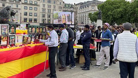 Sri Lankan Tamils paying respects at a memorial in London.