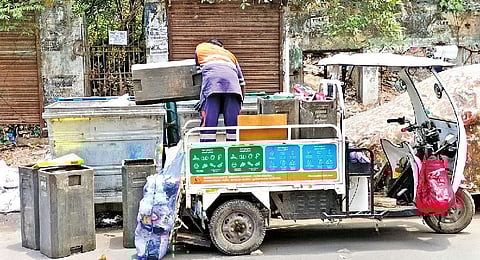 Workers seen dumping waste collected from door-to-door in garbage bins in Chennai