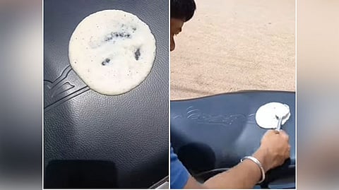 Man making Dosa on his scooter