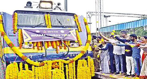 Officials flagging off the first train to Shirdi from Coimbatore on Tuesday