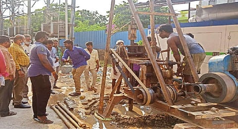 Officials inspecting borewell work at TNHB Villivakkam