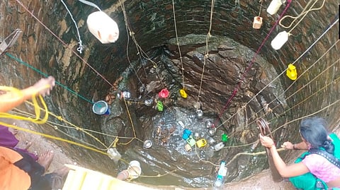 Villagers extracting water out of a well in Maharashtra's Khadial village.