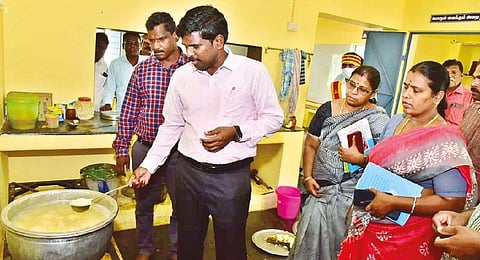 Collector M Pradeep Kumar inspecting the quality of food at the Government Tribal Welfare School at Sengattupatti on Pachamalai hills in Tiruchy on Saturday