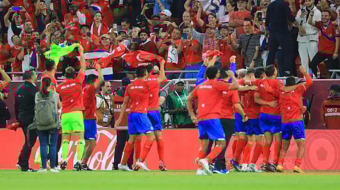 Costa Rica's players celebrate after qualifying for the World Cup