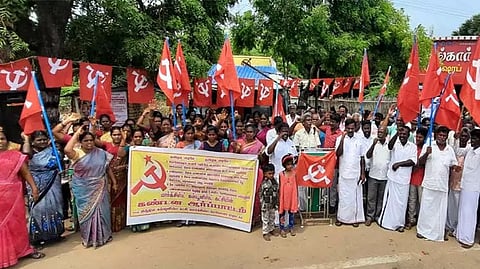 M Chinnadurai protesting for relief to the fisherwoman