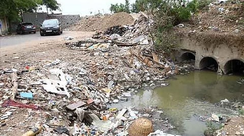 Recently, unknown people constructed compound walls, buildings at Balakrishna Nagar, VGP selva Nagar, and Bhuvaneswari Nagar which block the water flow through the channel to the waterbody.