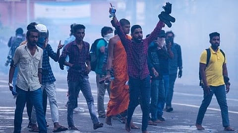 Police use tear gas shells to disperse demonstrators taking part in an anti-government protest demanding the resignation of Gotabaya Rajapaksa.
