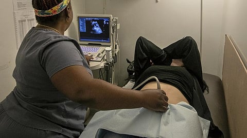 An operating room technician performs an ultrasound on a patient at Hope Medical Group for Women in Shreveport, La. With access to abortion flickering in Louisiana, the legal battle over the statewide ban continues with a court hearing scheduled to begin Monday
