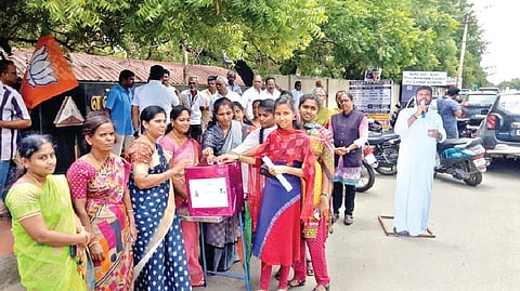 BJP workers during a campaign among college students in Tirupur on Friday.