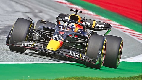 Max Verstappen celebrates after taking the pole position