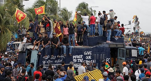 Protesters storm Sri Lankan prime minister's office as president flees to Maldives