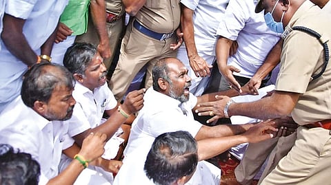 Police removing AIADMK cadre led by former minister RB Udhayakumar from protest venue near Kappalur toll plaza in Madurai on Monday