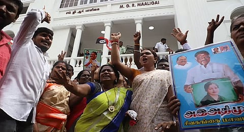 OPS supporters raise slogans supporting their leader.