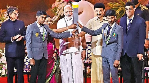 Prime Minister Narendra Modi holds the Chess Olympiad torch at the opening ceremony of the 44th Chess Olympiad