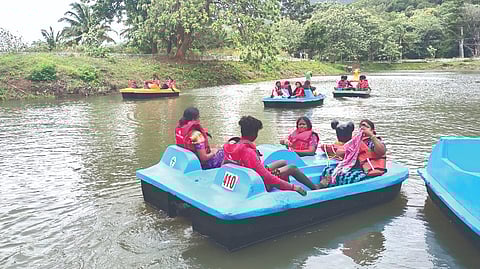 Tourists enjoy boat rides on Courtallam Lake after a gap of two years in Tenkasi district on Sunday