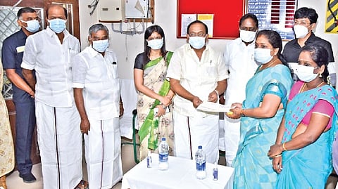 Food Minister R Sakkarapani distributing loans to the beneficiaries in Tiruvarur on Wednesday.