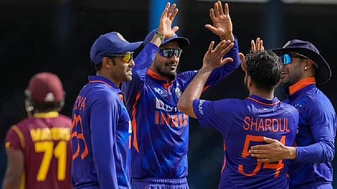 Teammates congratulate India's Shardul Thakur after the dismissal of West Indies' Kyle Mayers during the first ODI
