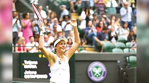 Tatjana Maria celebrates defeating Jelena Ostapenko