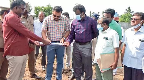 Collector Rahul Nath in discussion with local officials.