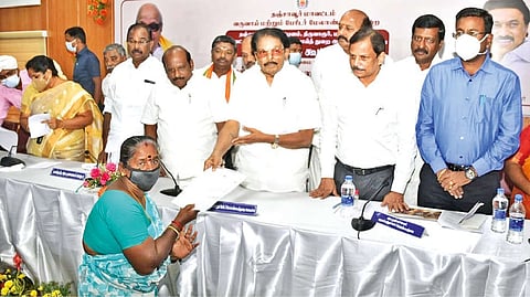 Revenue Minister KKSSR Ramachandran distributing welfare assistance to a beneficiary in Thanjavur on Friday