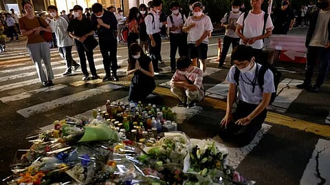 People pay respects at the site where late former Japanese PM Shinzo Abe was shot