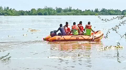 Fire and Rescue Service personnel searching for the bodies of the youth in Kollidam on Tuesday