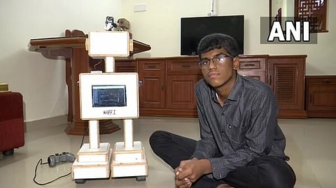 Chennai boy with a robot