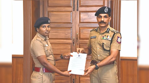 Cop M Amina receiving certificate of appreciation from DGP C Sylendra Babu in Chennai on Wednesday.
