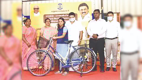Finance Minister PTR Palanivel Thiaga Rajan distributing bicycles to students in Madurai on Thursday.