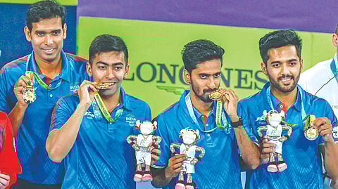 India?s Sharath Kamal, Harmeet Desai, Sathiyan Gnanasekaran and Sanil Shetty pose after winning the gold medal
