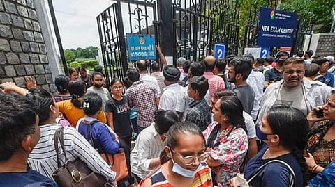 Students come out after appearing for the Common University Entrance Test-Undergraduate (CUET UG 2022), in the first slot, at North Campus in New Delhi.
