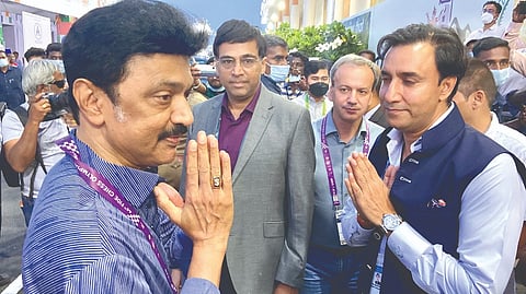 Cheif Minister MK Stalin (left) greets AICF president Sanjay Kapoor at the Chess Olympiad venue in Mahabalipuram on Sunday. Behind the duo is Viswanathan Anand.